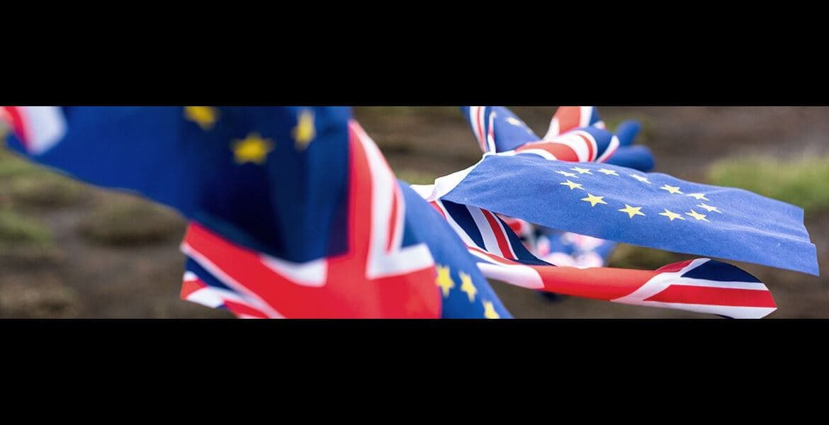 UK Union Jack Flag alongside some European Union flags