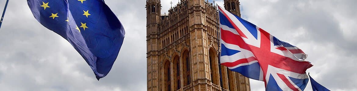 UK Union Jack Flag alongside some European Union flags with Big Ben in background