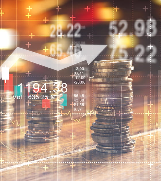 Coins on a table with a line chart overlay